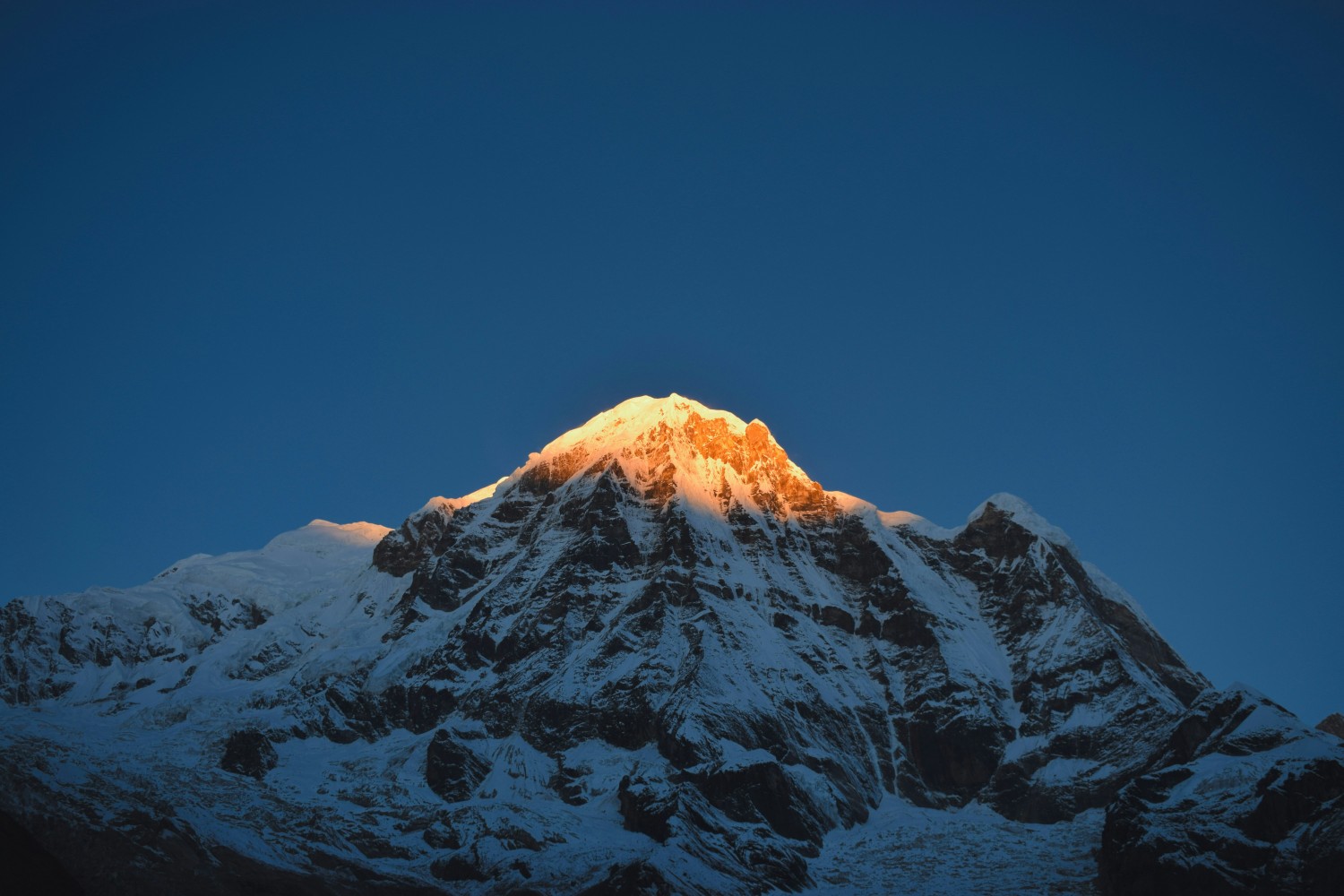 Sunlit Mountain Peak with Golden Rays